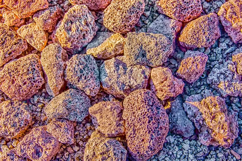 White porous pumice stones in a small wooden bowl ready for gardening